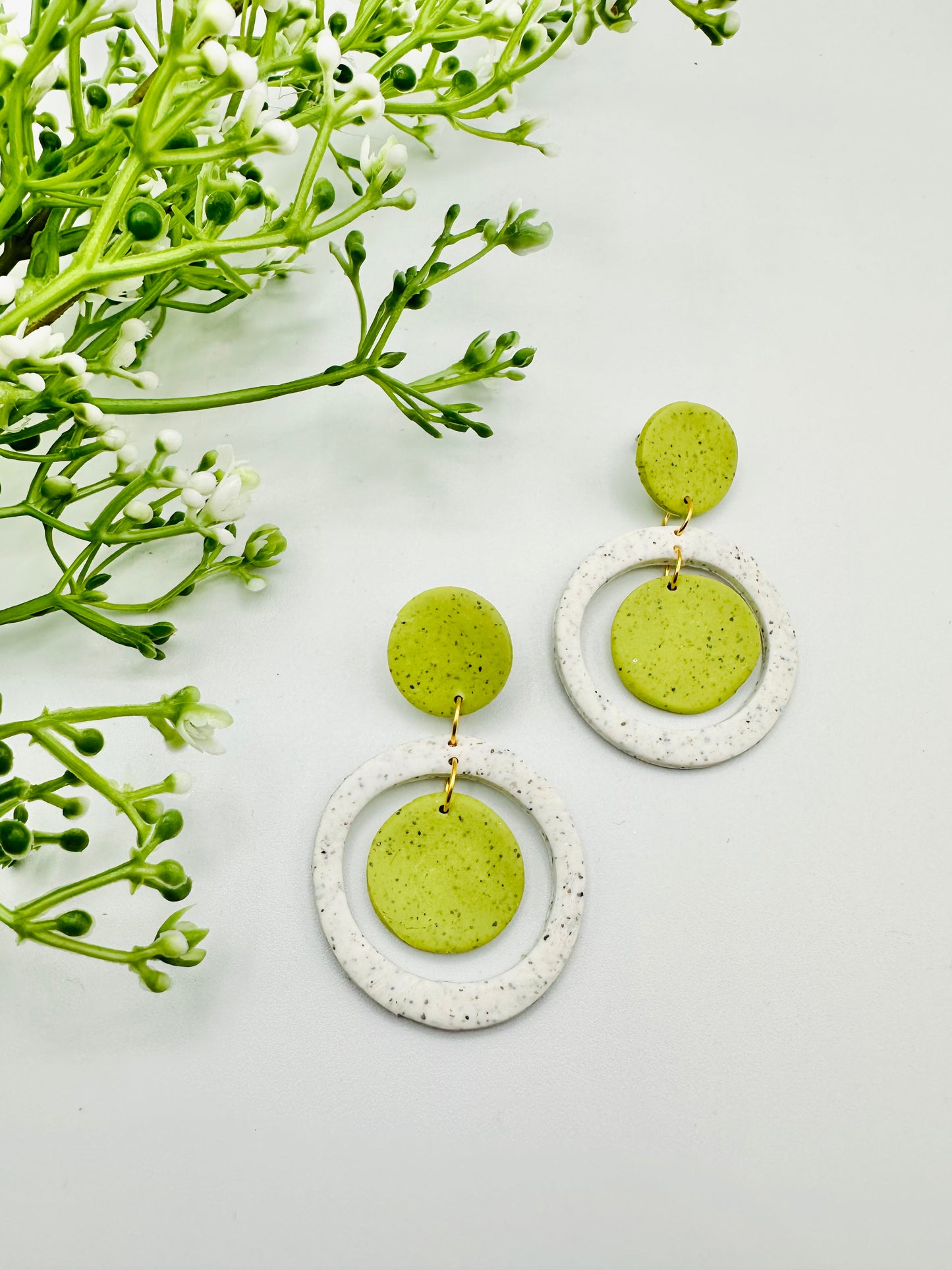 Circle dot cut out earrings - green/white