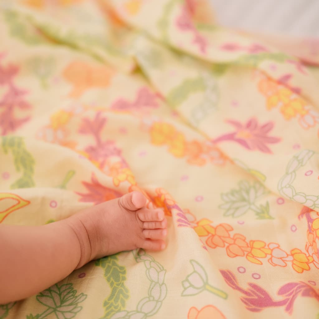 Lei Day in Sand Muslin Swaddle Blanket