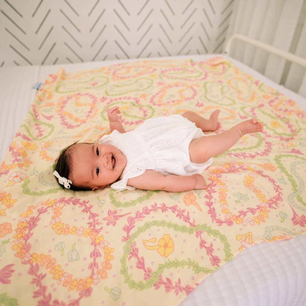 Lei Day in Sand Muslin Swaddle Blanket